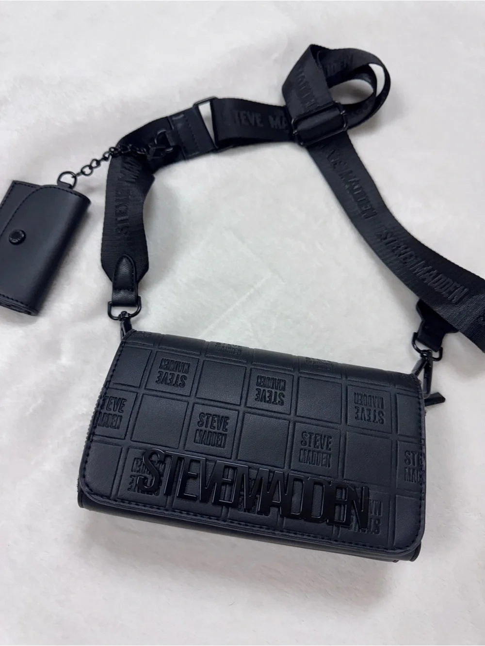 Steve Madden Black Embossed Logo Crossbody Bag.
